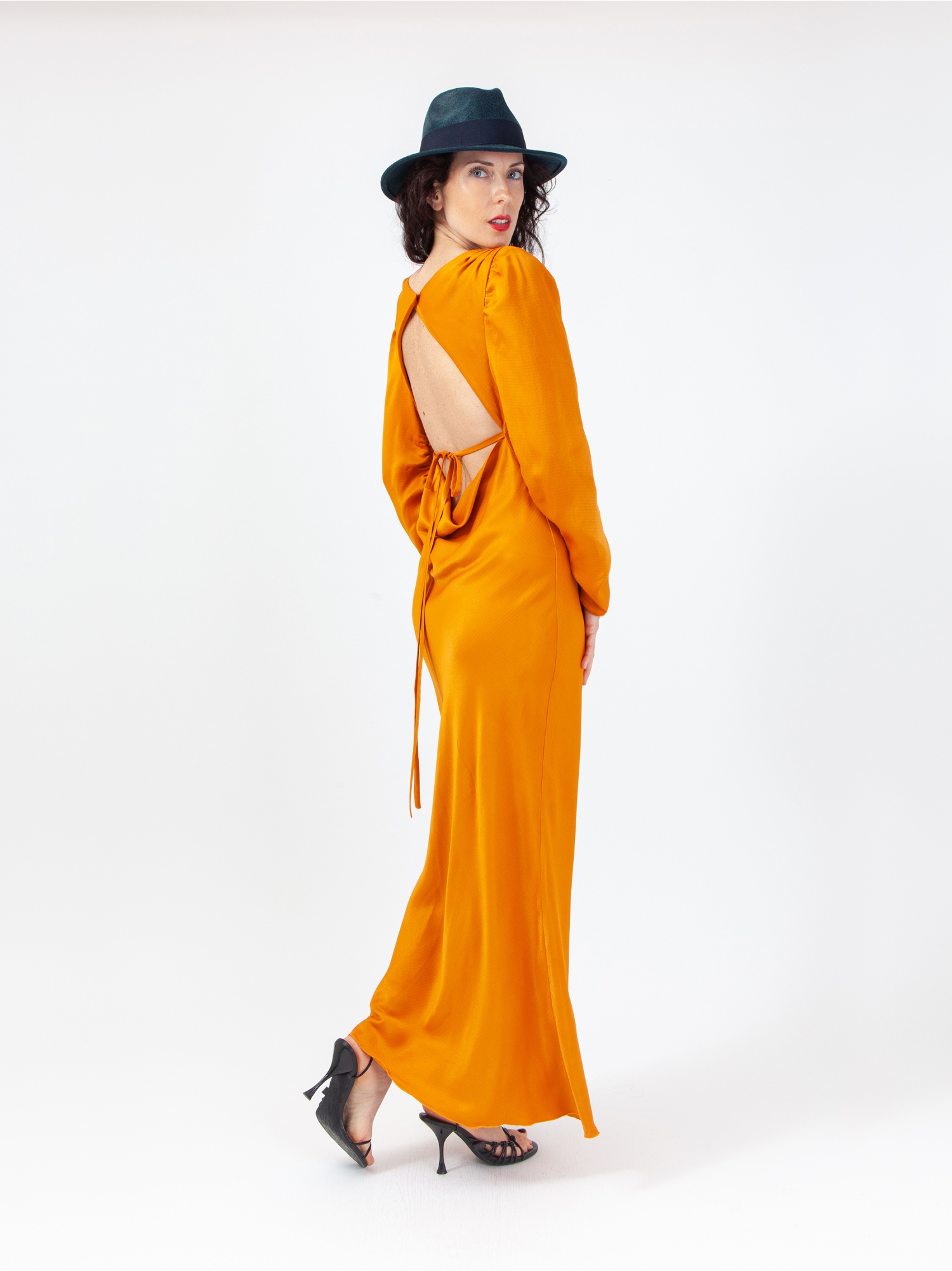 Soft orange satin woman dress, orange long dress, with gathered long sleeves and square neckline, laces at the waist and back out. Orange colour. 100% viscose, made in Italy. Buy online!